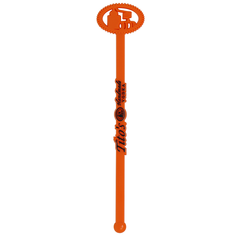 Orange Tita's stir stick with a oval top with ball end
