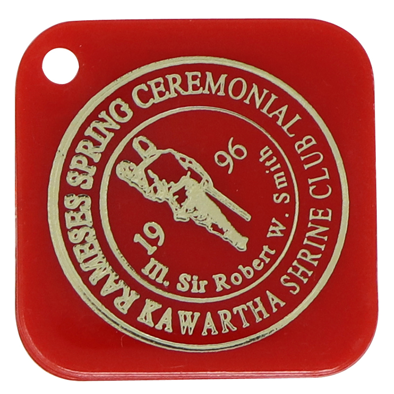 Plastic red square token with rounded corner and imprinted logo in gold