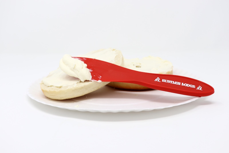 Red cream cheese spreader knife.