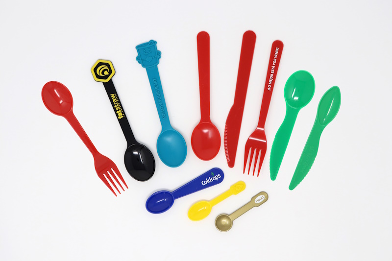 Samples of Harco's sporks, ice cream & yogurt spoons, forks, knives, kiwi spoons, and taster spoons.