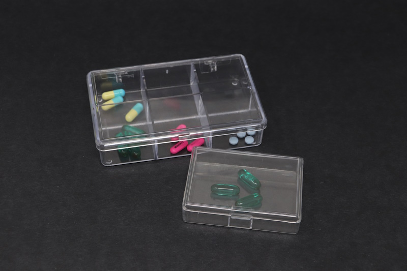 Small clear plastic pill containers.