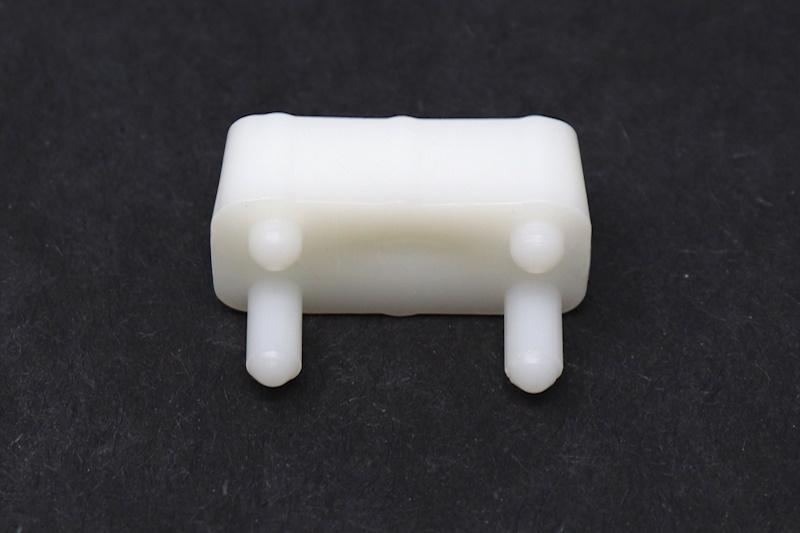 White plastic spreader clip.