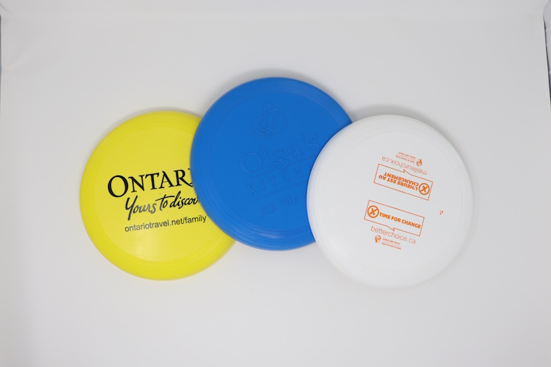 Yellow, blue, and white flying discs.